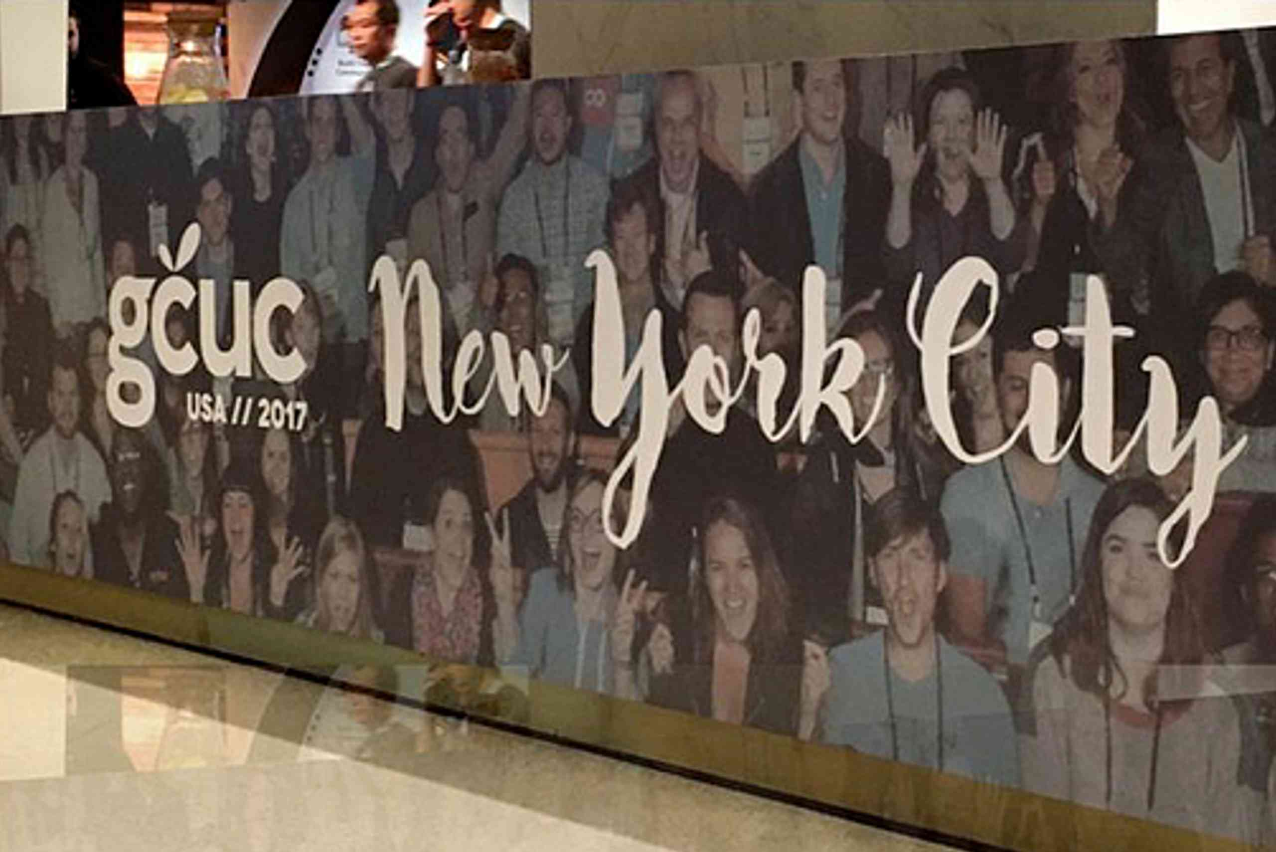 The New York City convention center, crowded with participants, hosts the GCUC coworking unconference event.