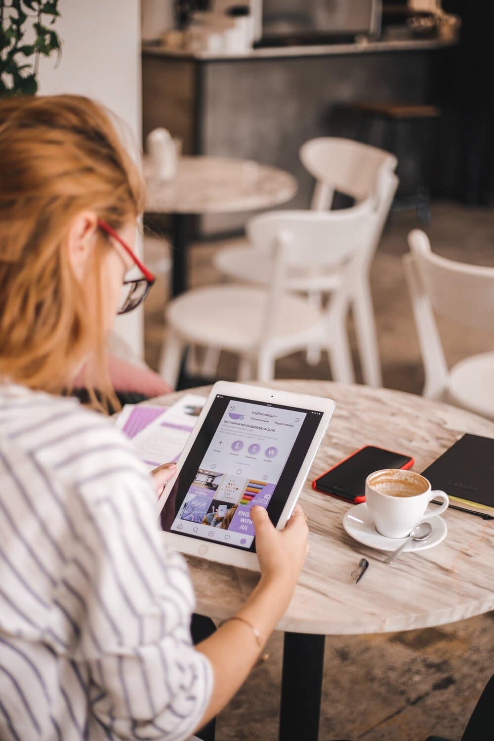 a lady working on her tablet on a desk at one of the third spaces