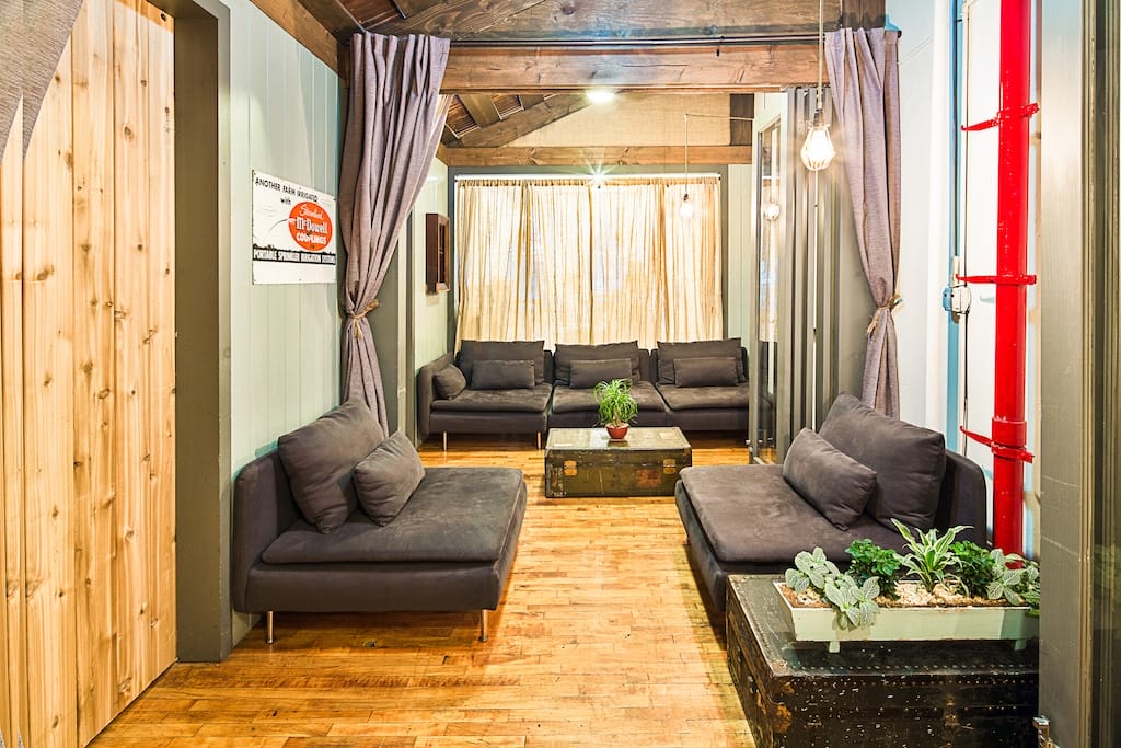 A stylish lounge area showcasing couches and a table, designed for relaxation and socializing in New York City.