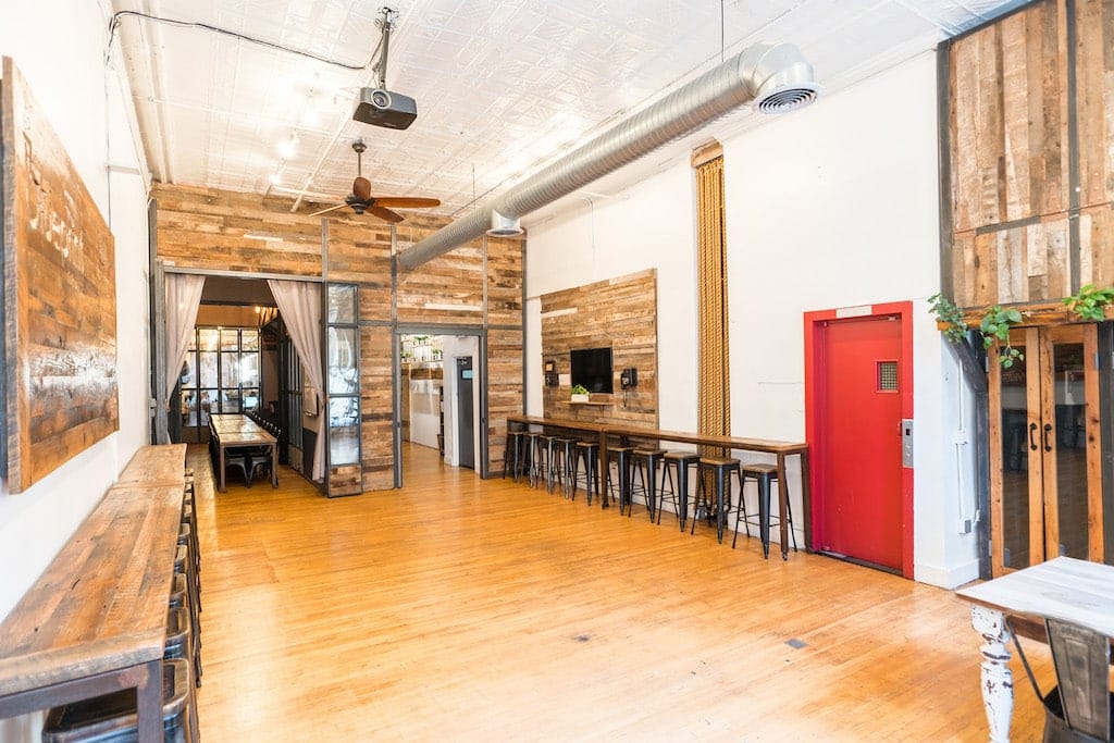 A bright and inviting coworking area at the intersection of Broadway, emphasizing a dynamic environment for productivity.
