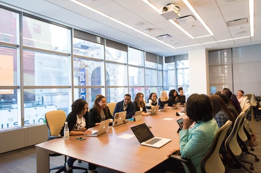 A team of business professionals seated at a conference table, focused on productive discussions and decision-making.