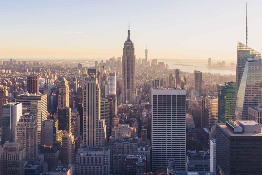 Aerial perspective of New York City skyline from the Empire State Building, featuring notable buildings and cityscape.