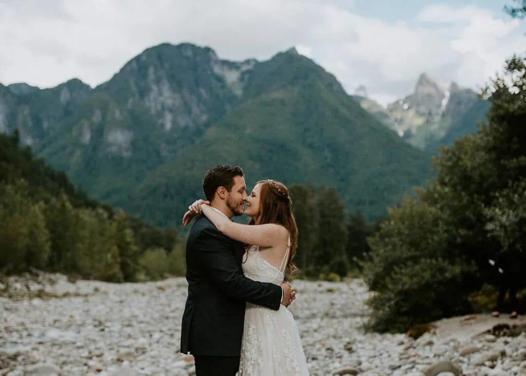 An enchanting wedding photograph set in the mountains, highlighting the union of love amidst nature, suited for Seattle's elite planners.